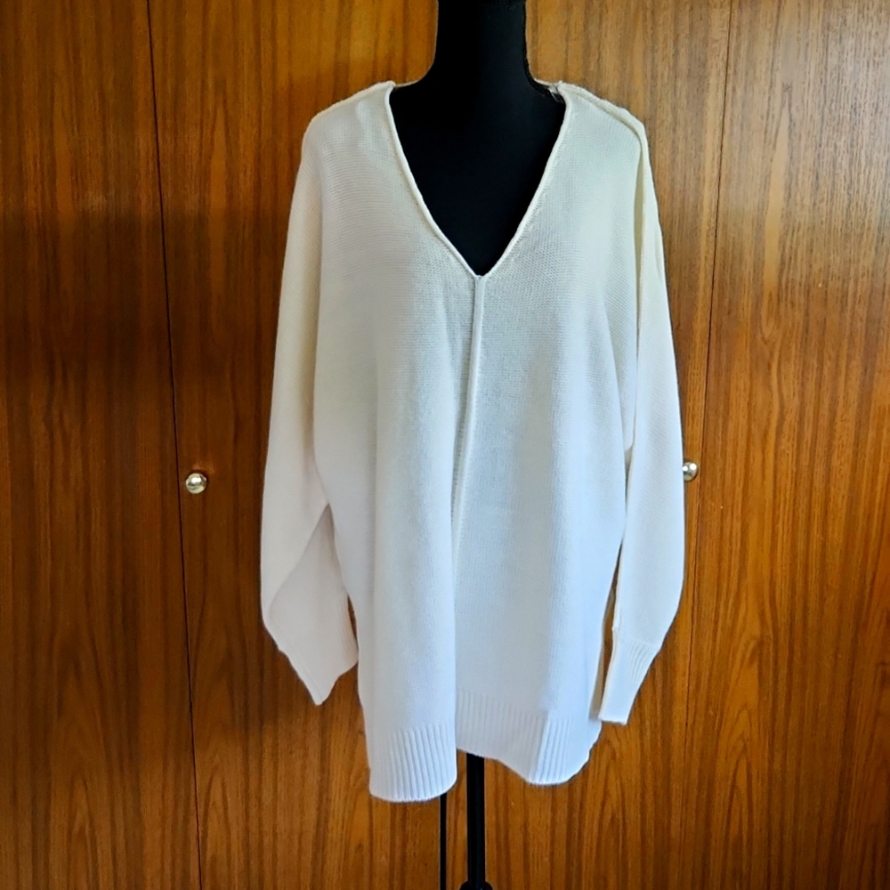 V-neck sweater. 100% acrylic.  2X cream. High-low hemline with side slit.